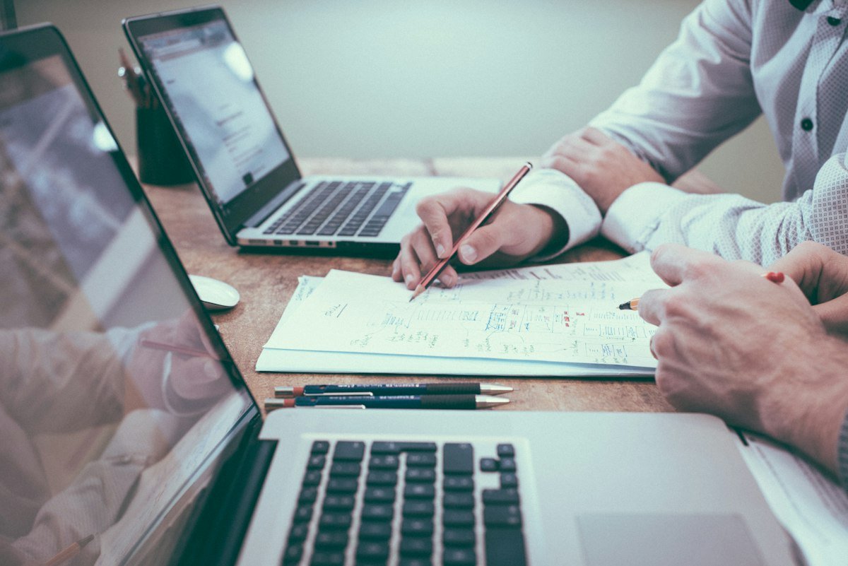 Professional migration agent calculating points matrix and organizing document checklist for Department of Home Affairs