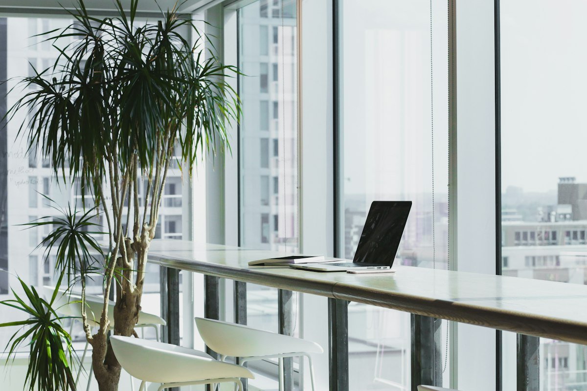 Executive commercial boardroom interior featuring frameless acoustic glass partitions and integrated presentation technology