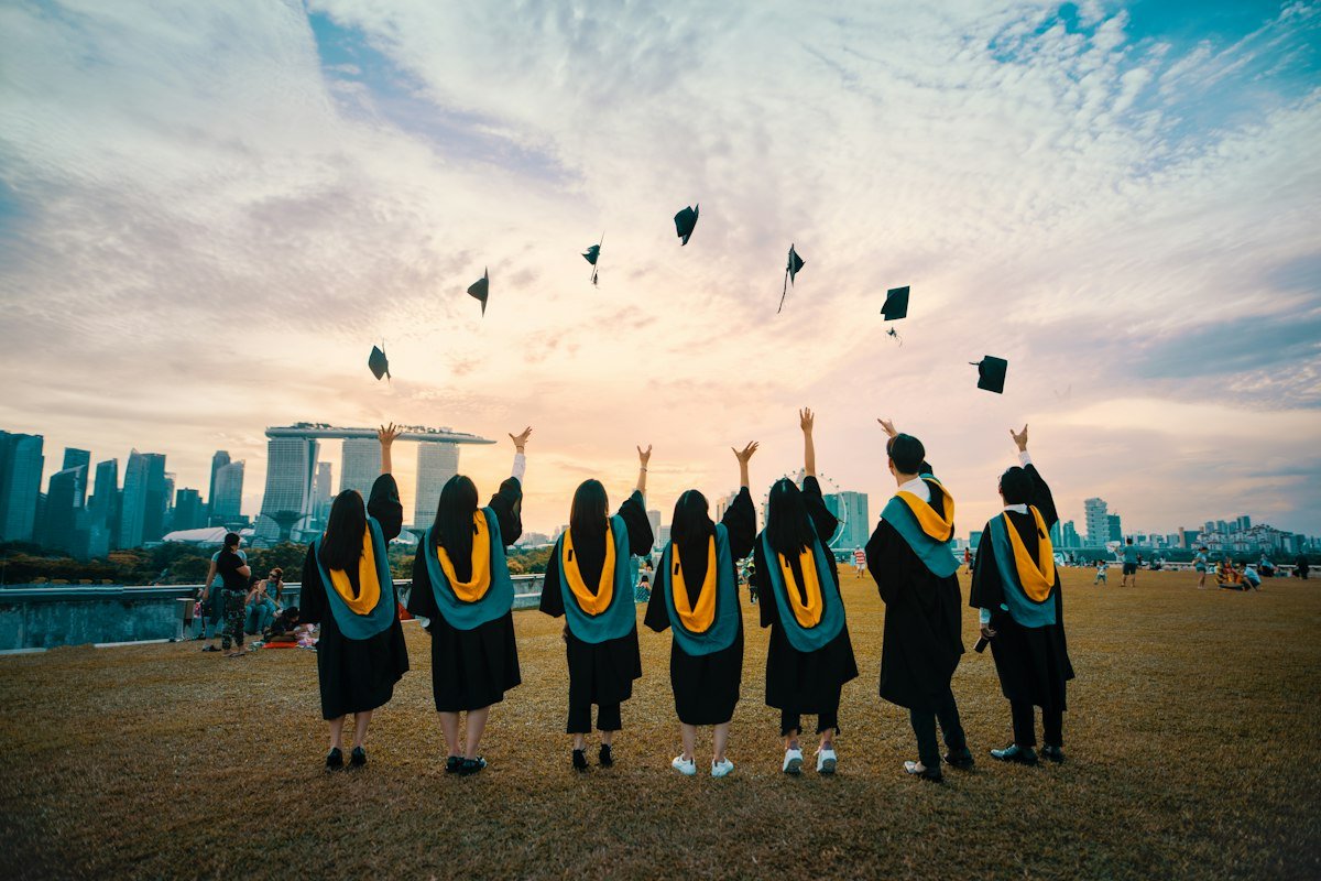Prospective international students exploring university course catalog and degree offerings on campus