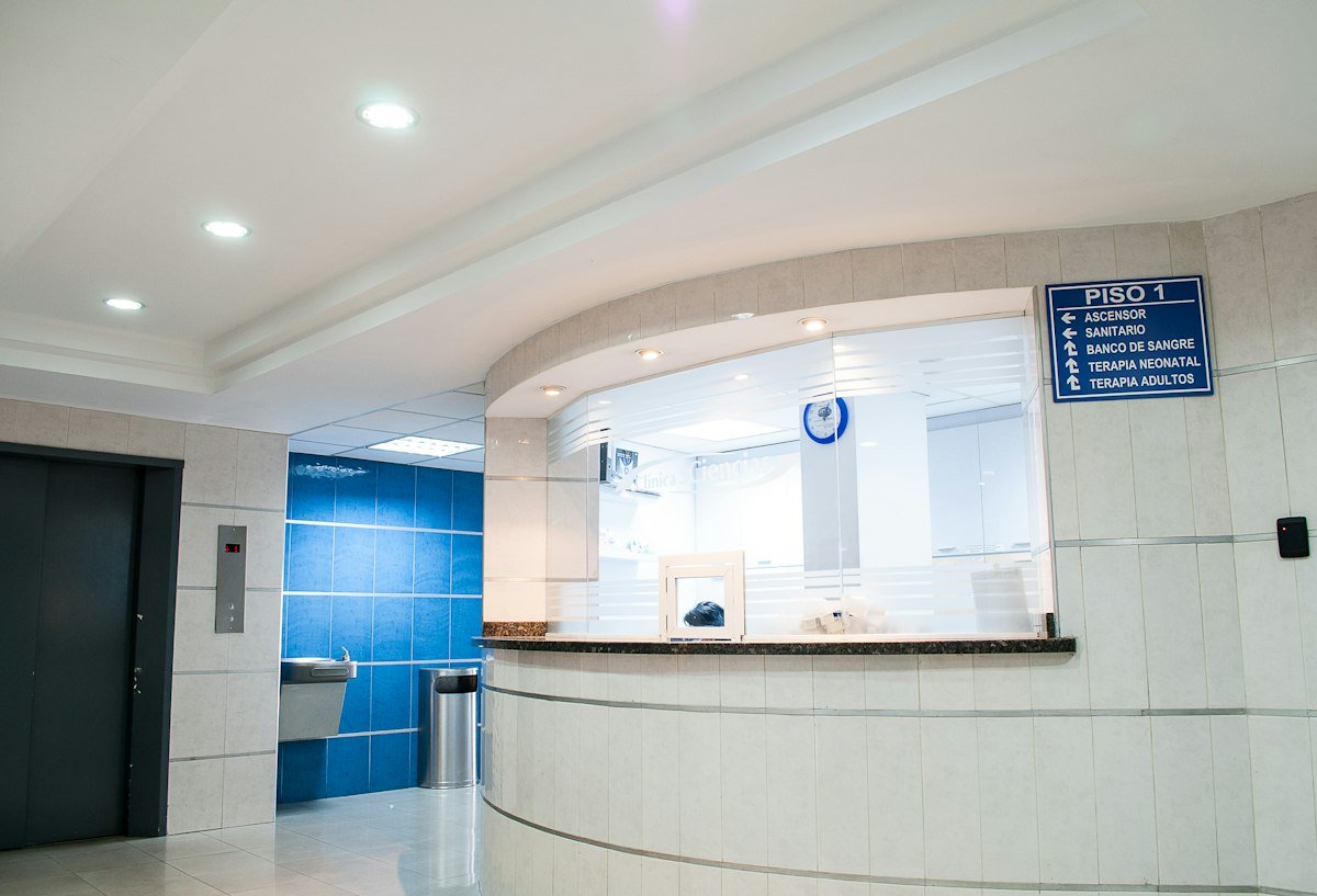 Welcoming, modern private clinic reception waiting area with minimalist British architectural furnishings